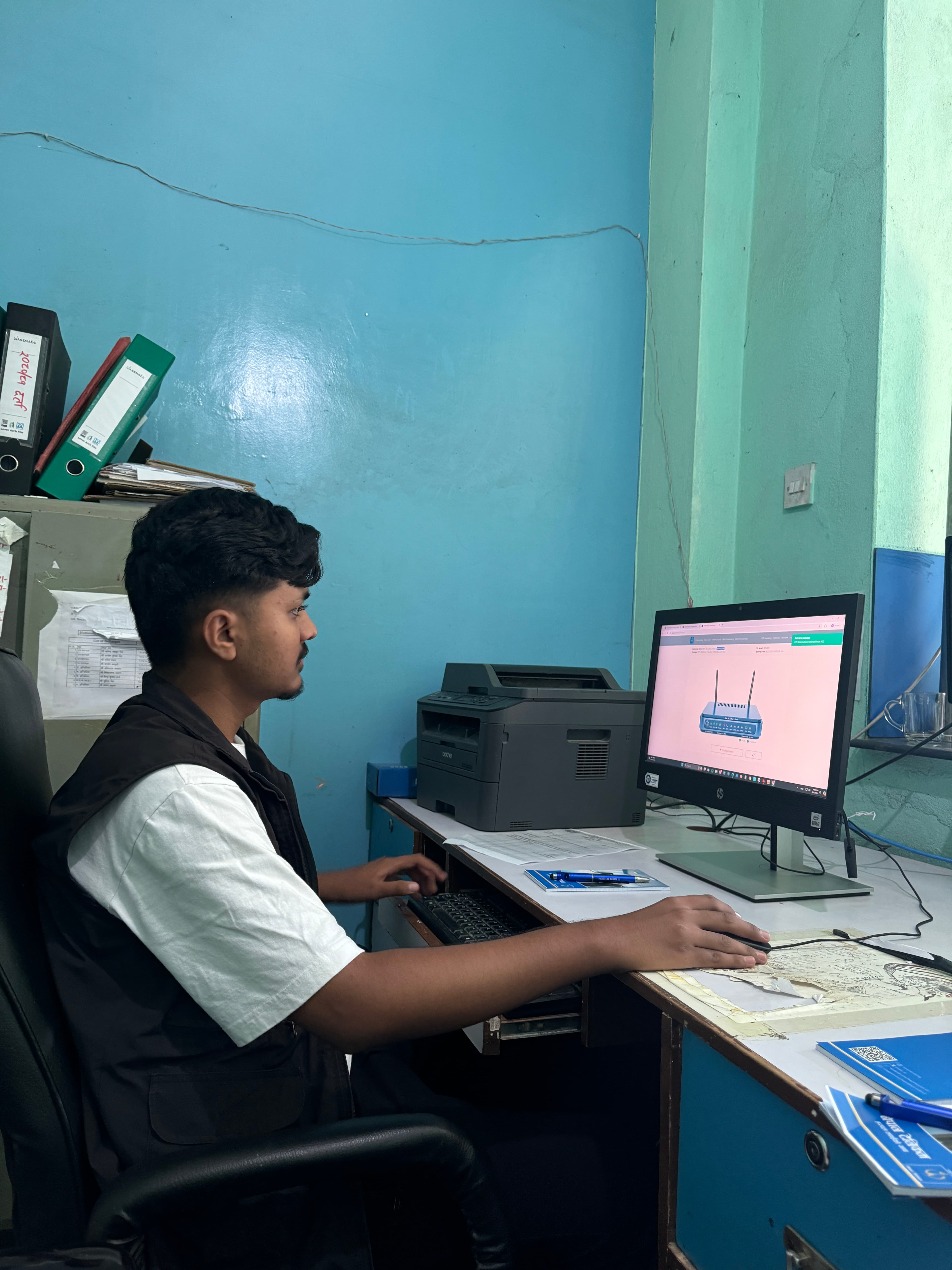 Rajib working during his internship at Nepal Telecom
